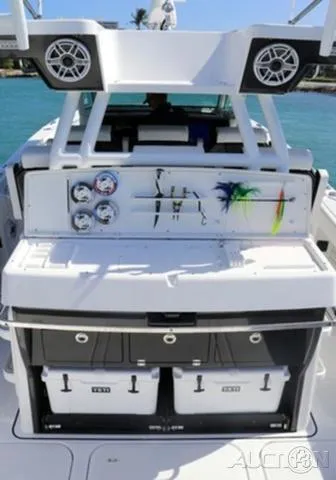 Slide: The Image of 2024 Blackfin 400CC boat with fishing gear and storage compartments. - 10