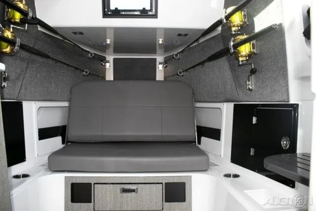 Slide: The Image of 2024 Blackfin 400CC cabin interior with seating and fishing rod storage. - 13