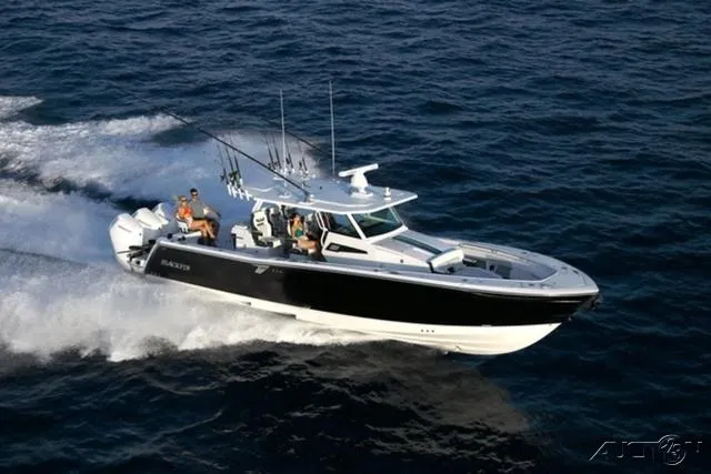 Slide: The Image of 2024 Blackfin 400CC boat cruising on open water. - 14