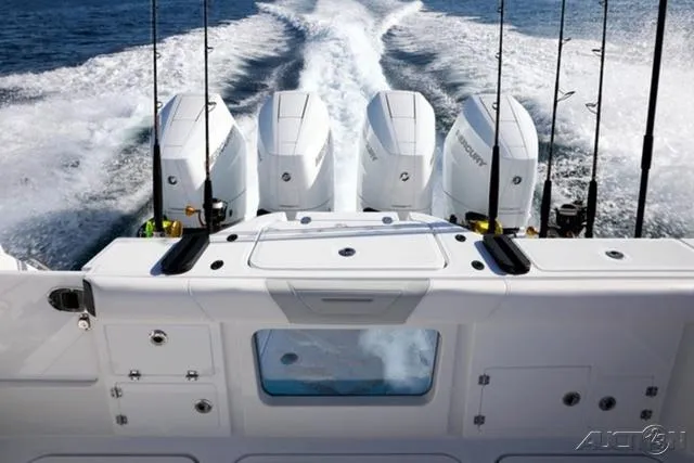 Slide: The Image of 2024 Blackfin 400CC boat with four powerful outboard engines. - 17