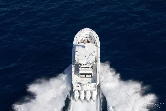 Slide: The Image of Aerial view of 2024 Blackfin 400CC boat cruising on open water. - 18