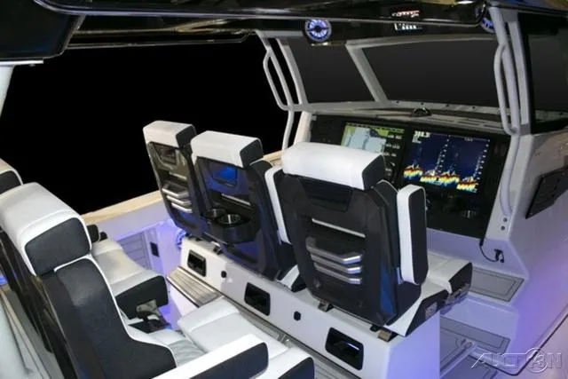 Slide: The Image of 2024 Blackfin 400CC boat cockpit with advanced navigation system and luxurious seating. - 6