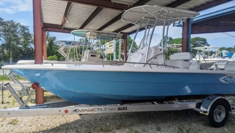 Slide: The Image of 2024 ALK2 Powerboats 22 CRX on a trailer under a metal canopy. - 0