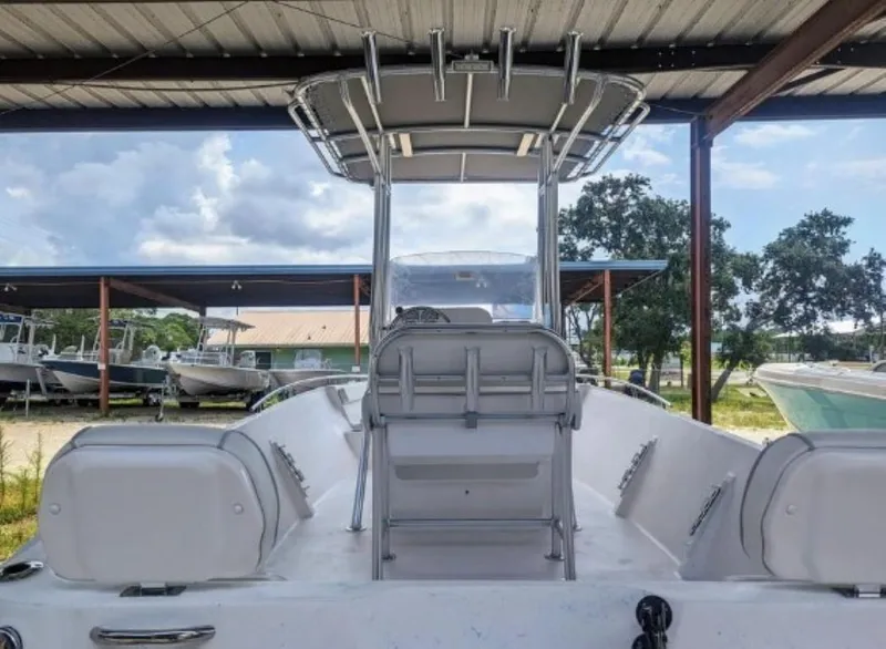 Slide: The Image of 2024 ALK2 Powerboats 22 CRX center console boat under a covered dock. - 10