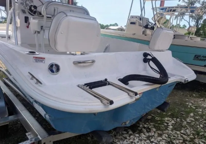 Slide: The Image of 2024 ALK2 Powerboats 22 CRX, rear view with swim ladder and seating. - 2