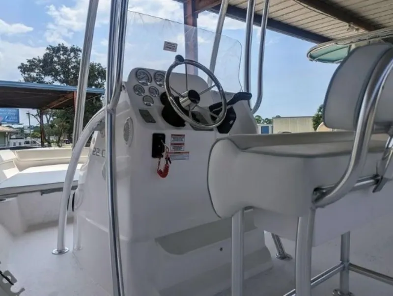 Slide: The Image of 2024 ALK2 Powerboats 22 CRX console and seating area. - 5