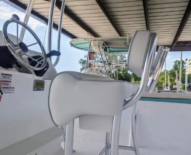 Slide: The Image of 2024 ALK2 Powerboats 22 CRX interior with steering wheel and seating. - 7