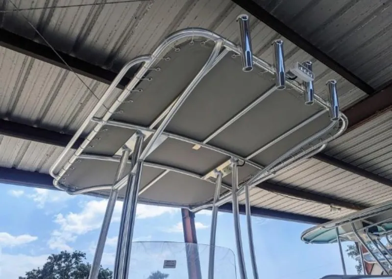 Slide: The Image of 2024 ALK2 Powerboats 22 CRX T-top under a metal canopy. - 8