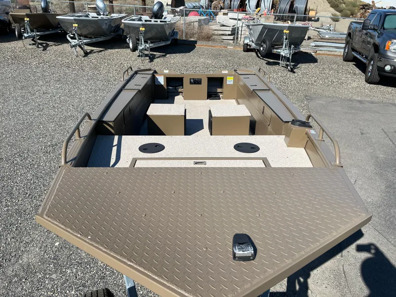 Slide: The Image of 2024 Smoker Craft 1660 Sportsman Pro fishing boat on display. - 2