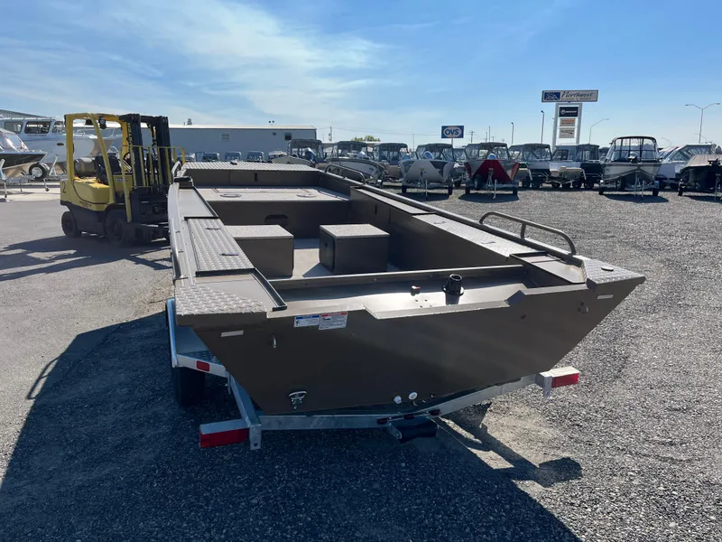 Slide: The Image of 2024 Smoker Craft 1660 Sportsman Pro boat on trailer in outdoor lot. - 4