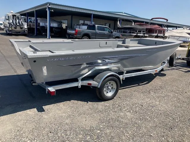 Slide: The Image of 2024 Smoker Craft 1866 Pro Sportsman boat on a trailer in a marina. - 1