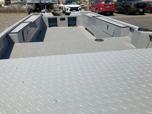 Slide: The Image of 2024 Smoker Craft 1866 Pro Sportsman boat interior with diamond plate flooring. - 3