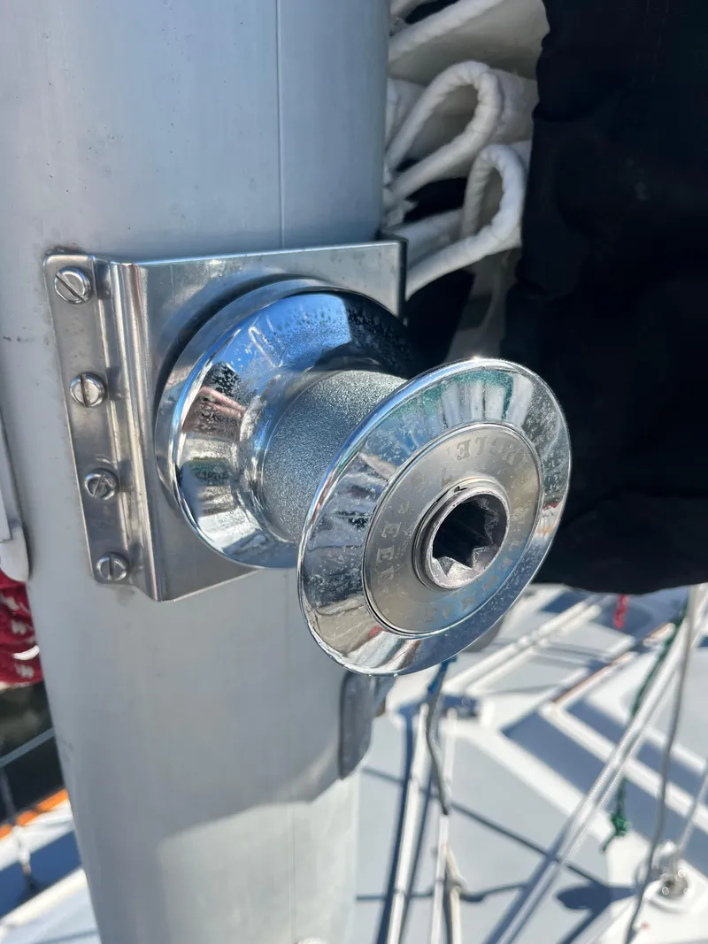 Slide: The Image of Chrome winch on 1985 Cape Dory 270 sailboat mast, with rigging visible. - 19