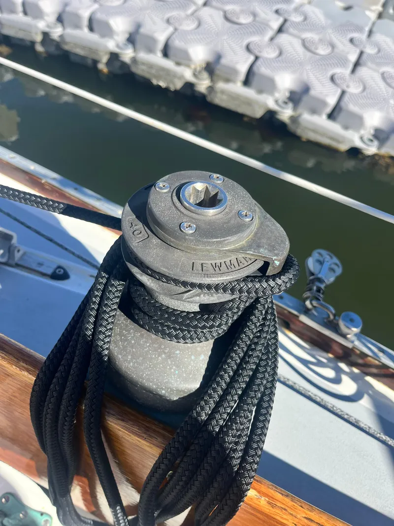 Slide: The Image of Winch on 1985 Cape Dory 270 sailboat with black rope, dock in background. - 21