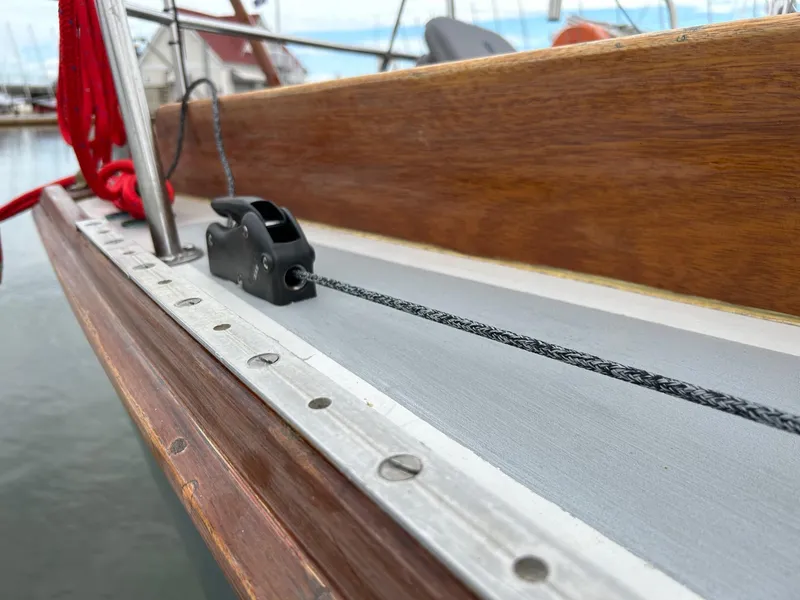 Slide: The Image of Close-up of 1985 Cape Dory 270 sailboat deck with rigging and wooden trim. - 22