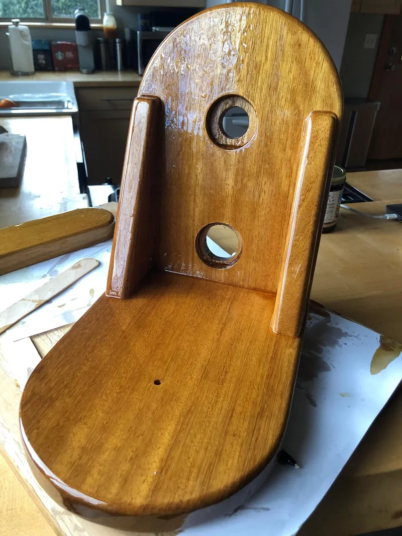 Slide: The Image of Polished wooden part of a 1985 Cape Dory 270 boat. - 27