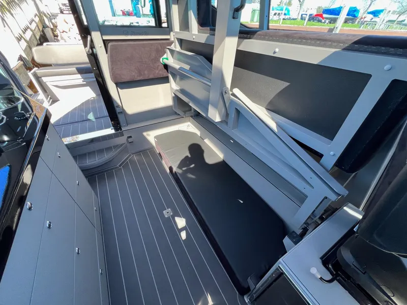 Slide: The Image of Interior of 2024 G-Force G-Force 10 boat with foldable seating and modern design. - 14