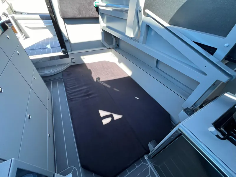 Slide: The Image of 2024 G-Force 10 interior cabin with storage compartments and a foldable bed. - 15