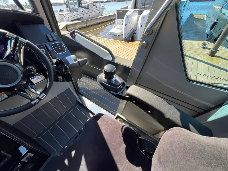 Slide: The Image of Interior cockpit of 2024 G-Force G-Force 10 boat with joystick control and steering wheel. - 21