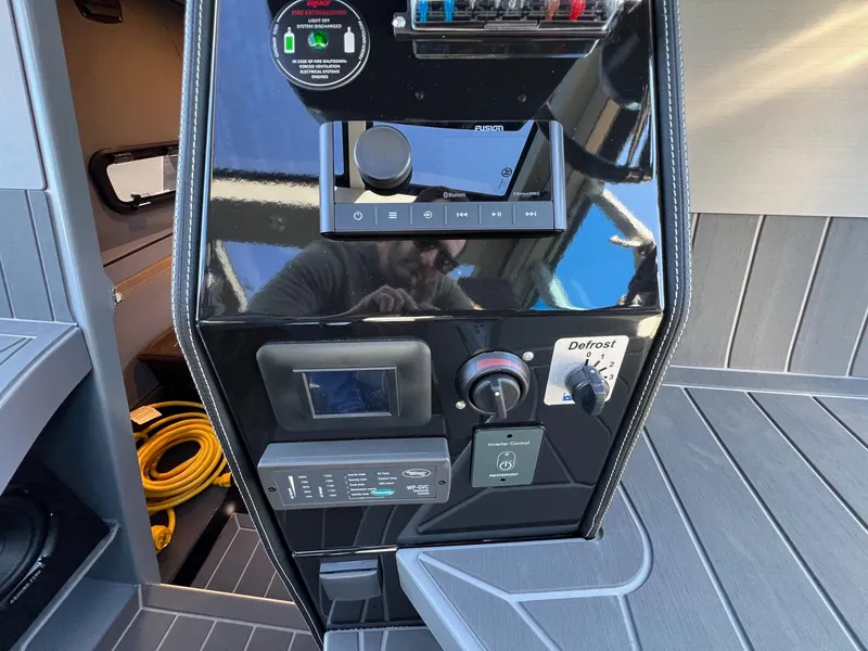 Slide: The Image of Control panel of 2024 G-Force G-Force 10 boat with various switches and displays. - 27