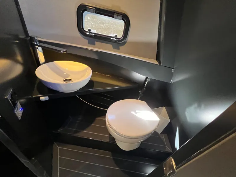 Slide: The Image of Modern bathroom in 2024 G-Force 10 RV with sink and toilet. - 29