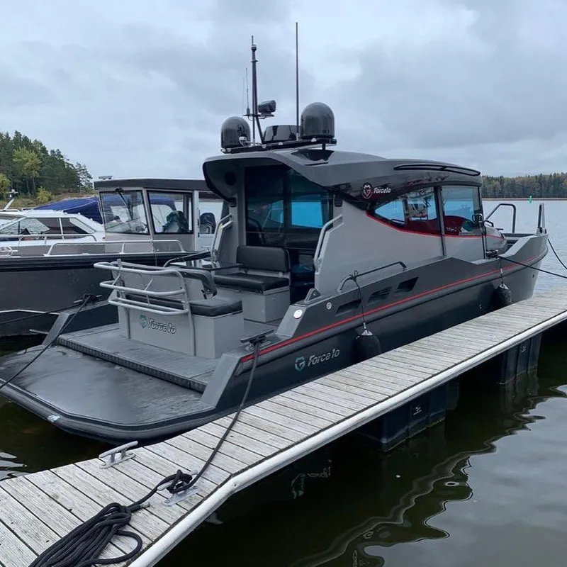 Slide: The Image of 2024 G-Force 10 boat docked at a marina on a cloudy day. - 35