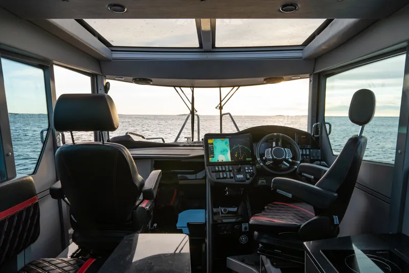 Slide: The Image of Interior cockpit view of 2024 G-Force G-Force 10 boat with ocean in background. - 42