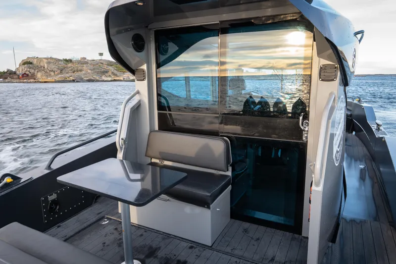 Slide: The Image of 2024 G-Force G-Force 10 boat with rear seating and table, ocean view. - 43