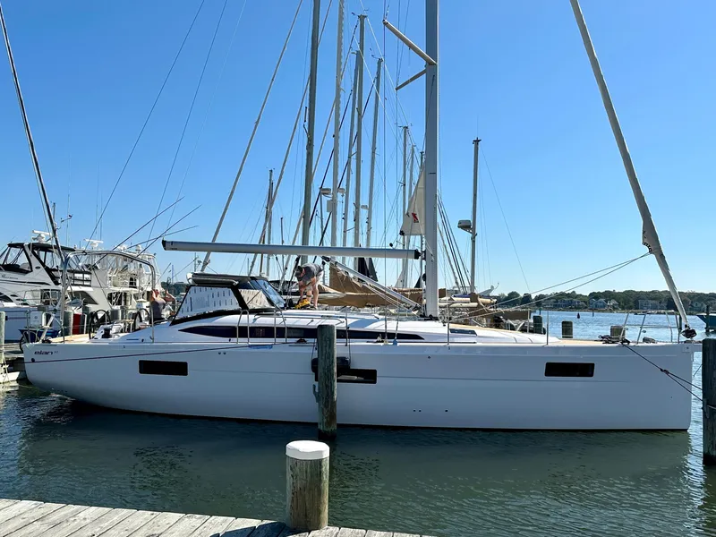 Slide: The Image of 2024 Elan Impression 43 sailboat docked at a marina. - 1