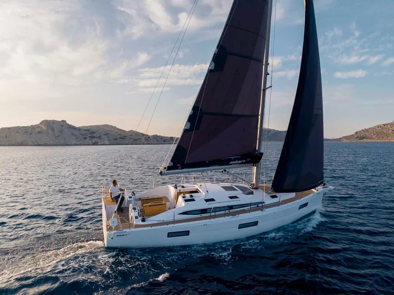 Slide: The Image of 2024 Elan Impression 43 sailing yacht on open water. - 10