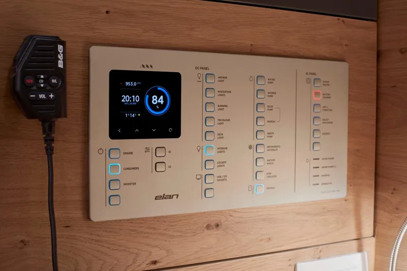 Slide: The Image of Control panel of 2024 Elan Impression 43 yacht with digital display and microphone. - 13