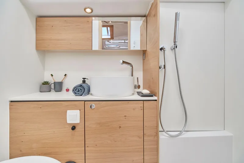 Slide: The Image of Modern bathroom in 2024 Elan Impression 43 yacht with wooden cabinets and sleek fixtures. - 14