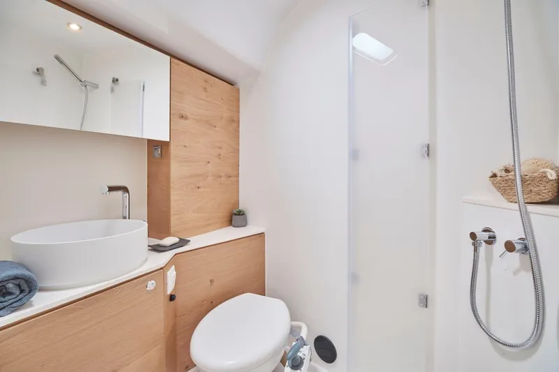 Slide: The Image of Modern bathroom in 2024 Elan Impression 43 yacht with wooden accents and sleek fixtures. - 15