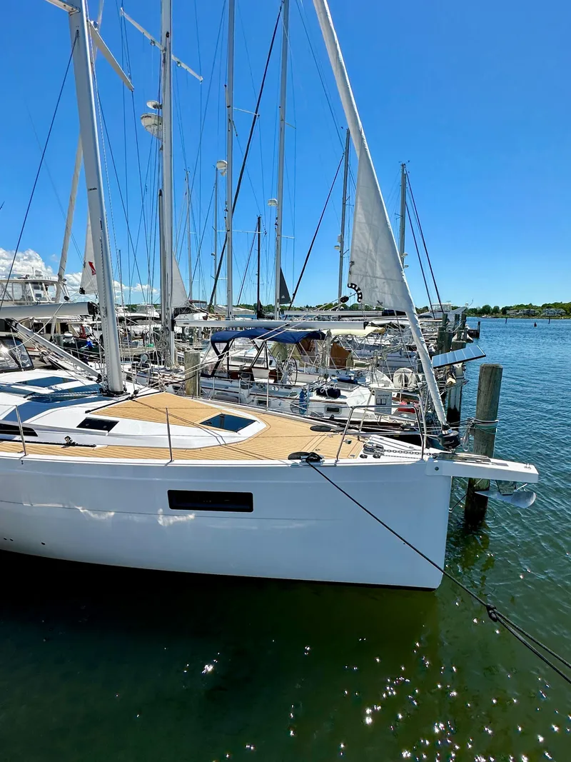 Slide: The Image of 2024 Elan Impression 43 sailboat docked in sunny marina. - 19