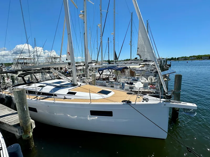 Slide: The Image of 2024 Elan Impression 43 sailboat docked in a sunny marina. - 20