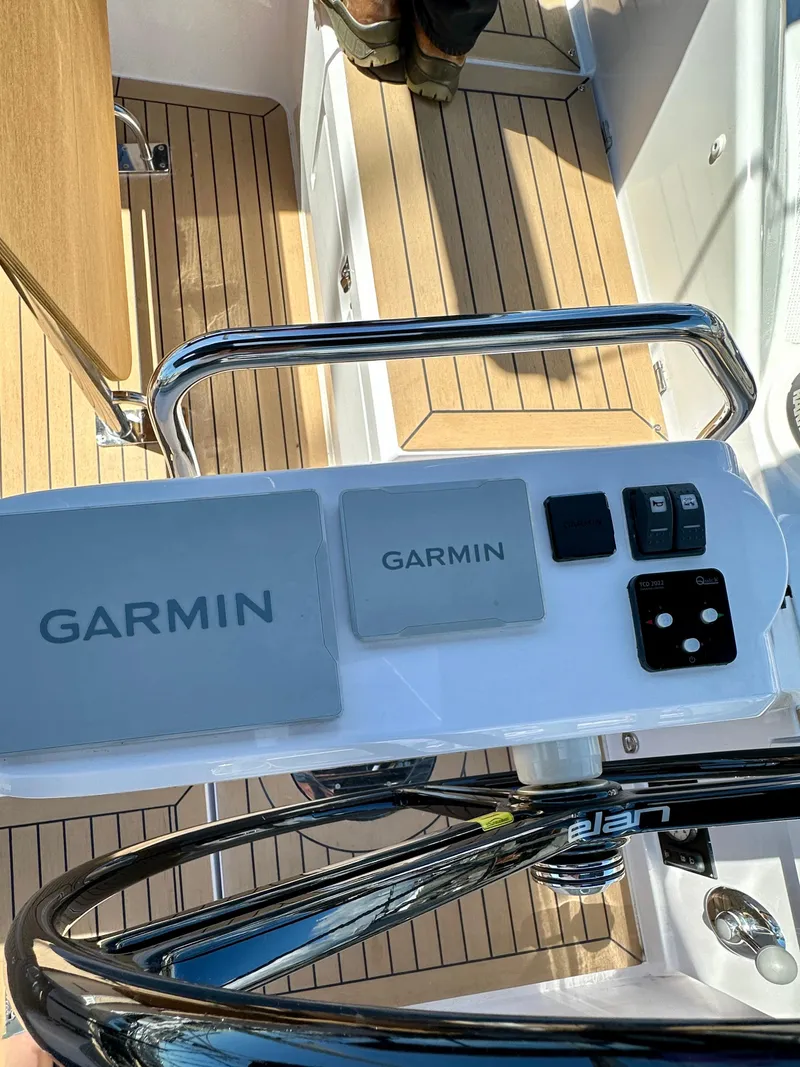 Slide: The Image of 2024 Elan Impression 43 yacht helm with Garmin navigation system and teak decking. - 27