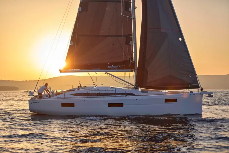 Slide: The Image of 2024 Elan Impression 43 sailboat at sunset on the open sea. - 3