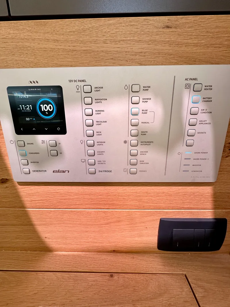 Slide: The Image of Control panel of 2024 Elan Impression 43 yacht, featuring digital display and switches. - 30