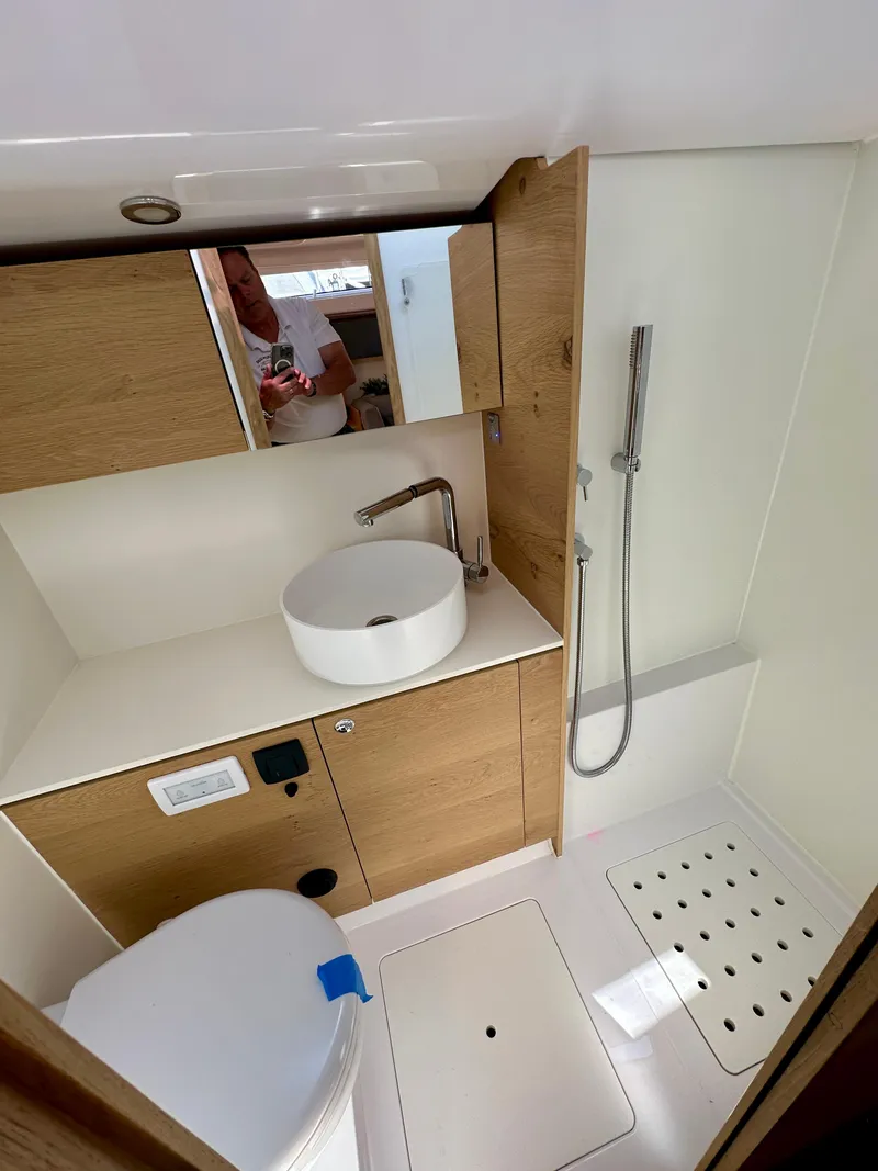 Slide: The Image of Modern bathroom in 2024 Elan Impression 43 yacht with sleek fixtures and wooden cabinetry. - 34