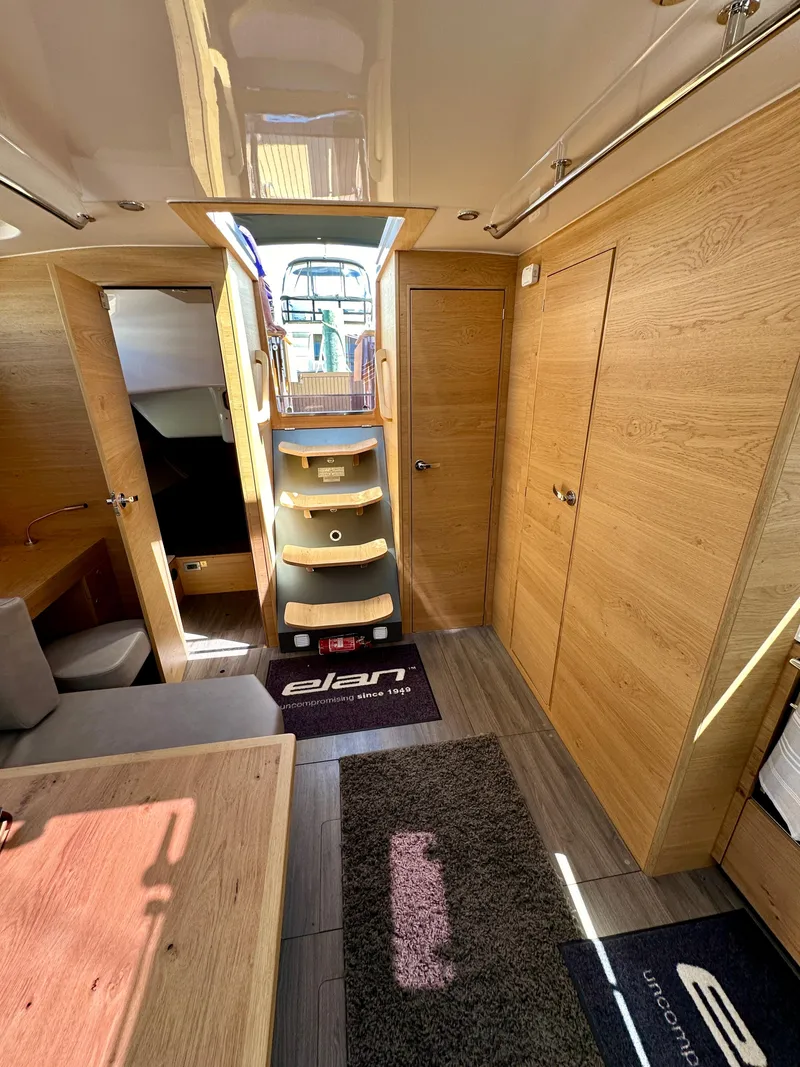 Slide: The Image of 2024 Elan Impression 43 yacht interior with wooden finish and modern design. - 37