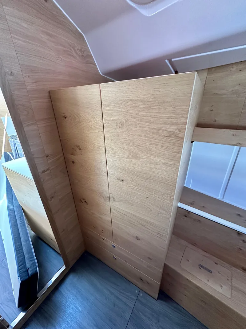 Slide: The Image of 2024 Elan Impression 43 interior with wooden cabinetry and modern design. - 41