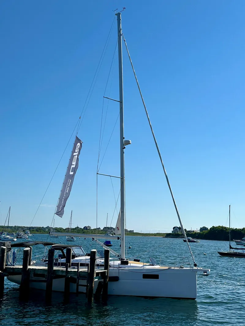 Slide: The Image of 2024 Elan Impression 43 sailboat docked on a sunny day. - 44