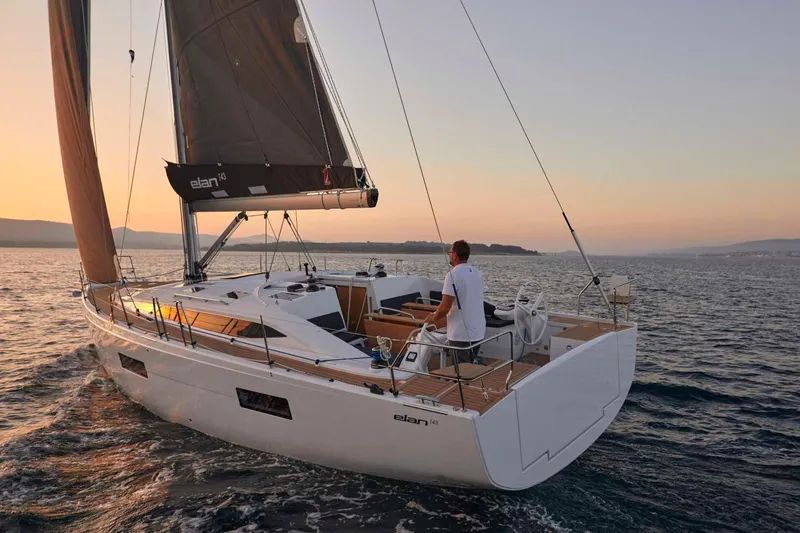 Slide: The Image of 2024 Elan Impression 43 sailing yacht at sunset. - 5