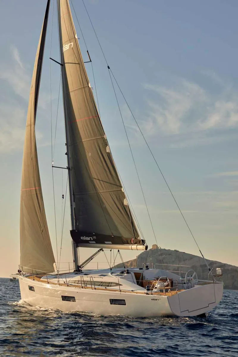 Slide: The Image of 2024 Elan Impression 43 sailing yacht on open water. - 8