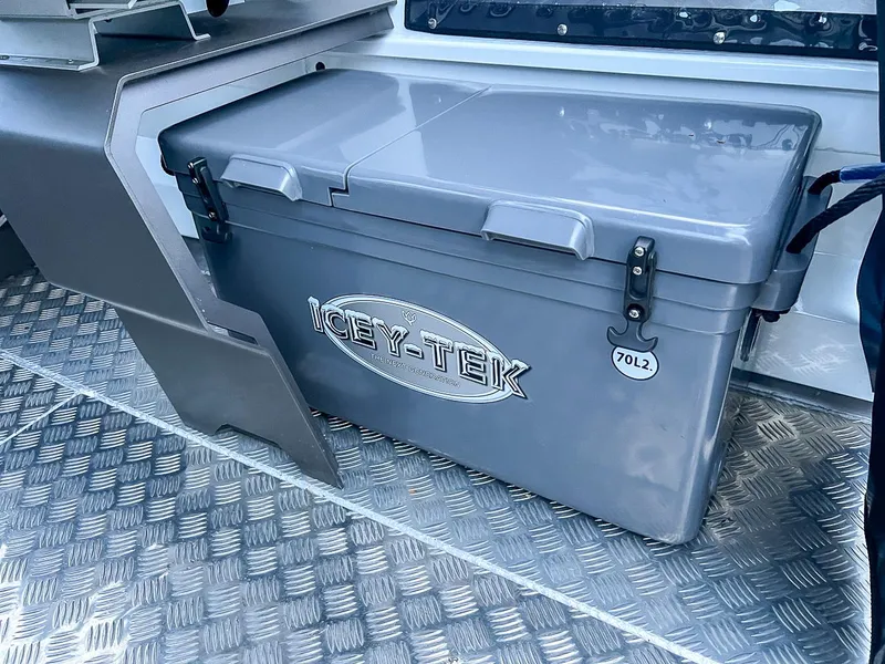 Slide: The Image of Icey-Tek cooler on 2024 Stabicraft 1850 Fisher boat with diamond plate flooring. - 12