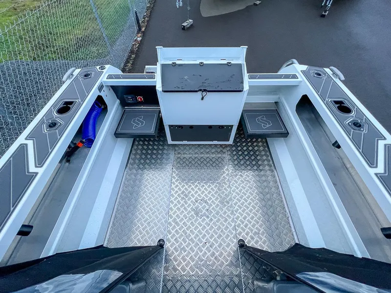 Slide: The Image of 2024 Stabicraft 1850 Fisher boat interior with storage compartments and non-slip flooring. - 13