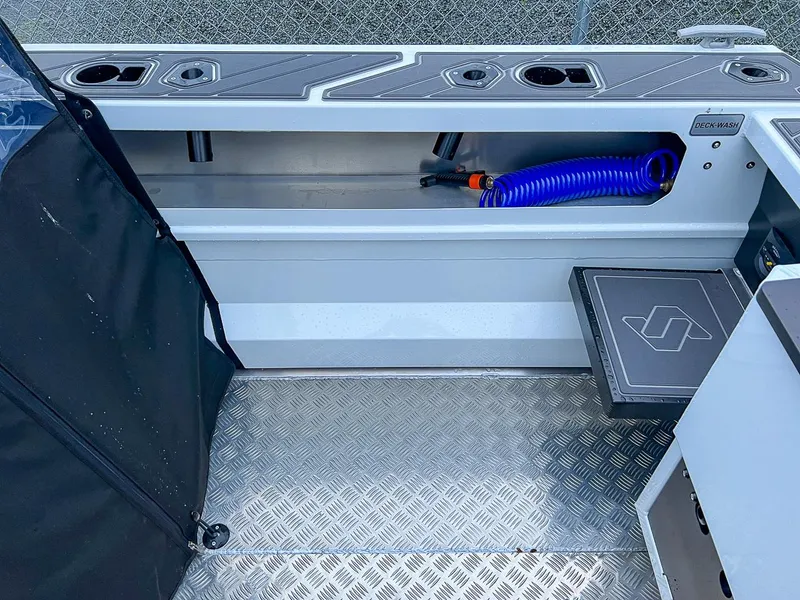 Slide: The Image of 2024 Stabicraft 1850 Fisher boat interior with deck wash and storage compartments. - 16