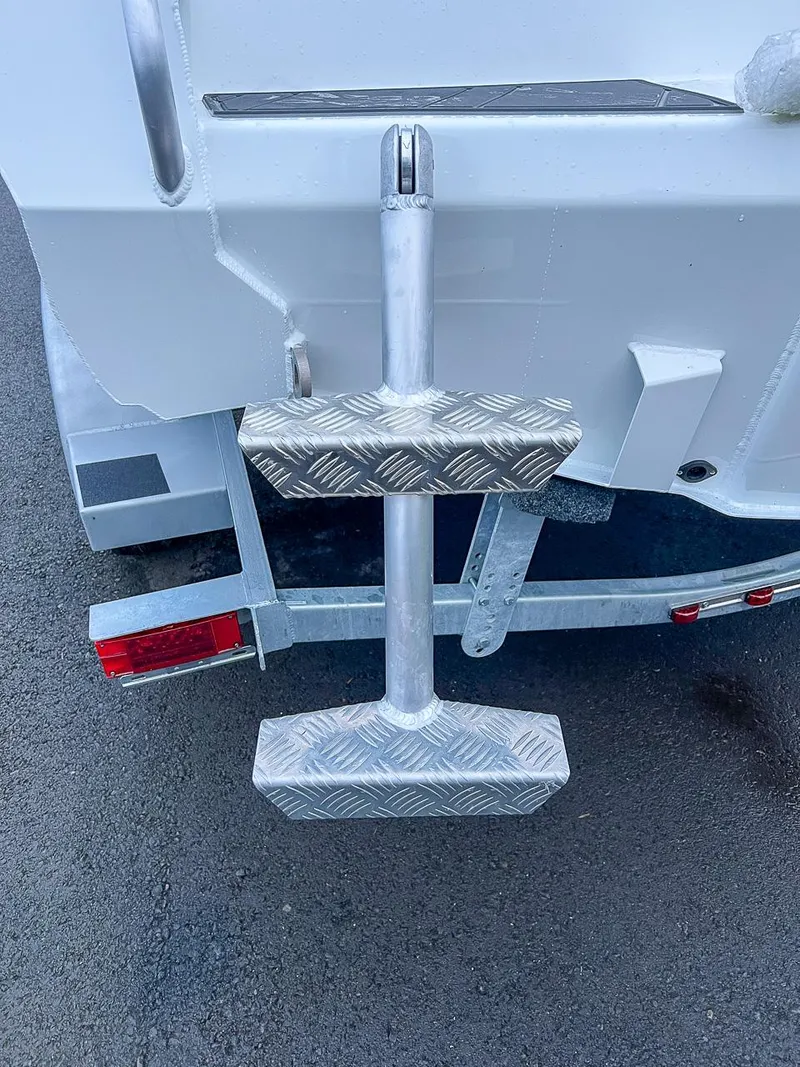 Slide: The Image of 2024 Stabicraft 1850 Fisher boat trailer with metal step ladder. - 17