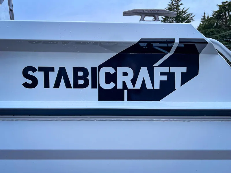 Slide: The Image of Stabicraft 1850 Fisher 2024 model boat logo on white hull. - 19