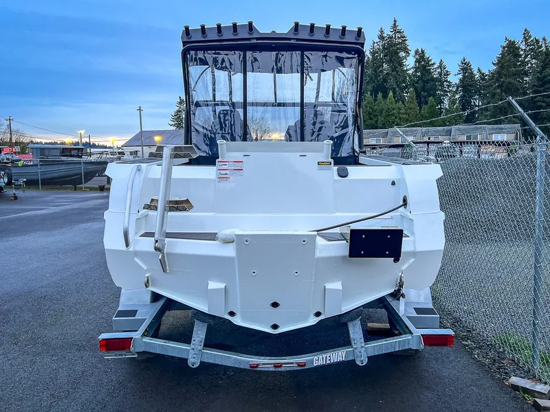 Slide: The Image of 2024 Stabicraft 1850 Fisher boat on trailer, rear view, in a marina. - 4
